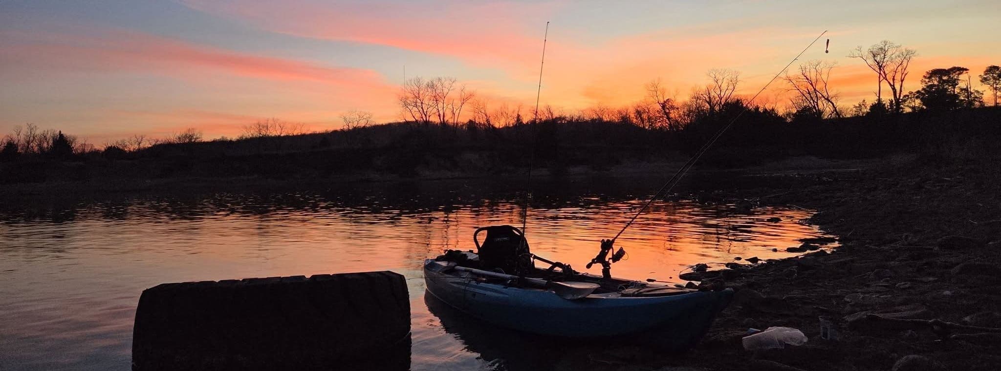 Kayak on a quiet lake at sunset